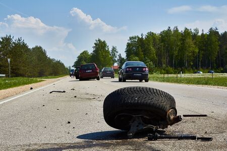 car parts after accident on a road because of frontal collision in May 23,2019, in Latvia, next Sauriesi, transportation backgroundのeditorial素材