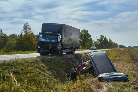 Svetciems, Latvia, August 29, 2019: accident on a road, car collision with a heavy truckのeditorial素材
