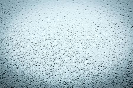 Water drops on glass, abstract backgroundの写真素材