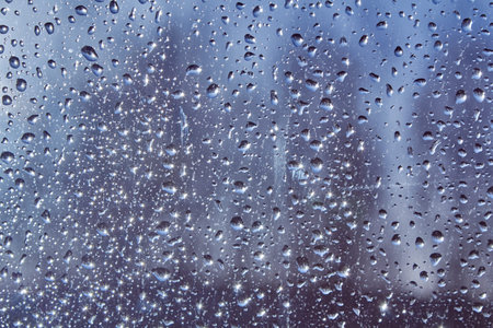 Water drops on glass, abstract background