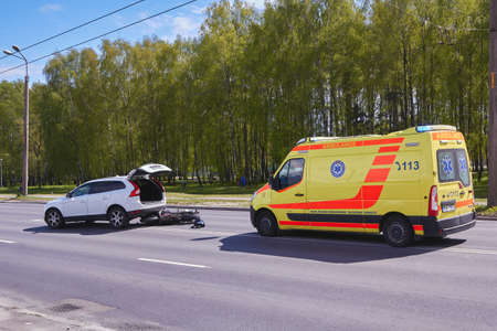 May 15, 2020, Riga, Latvia, damaged car and motorbike on the city road at the scene of an accident because of non-observance of distanceのeditorial素材