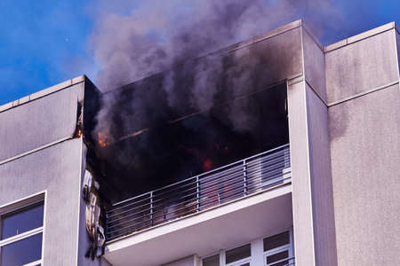 April 21, 2020, Riga Latvia: fire in a multitorey residential building on the top floorの写真素材