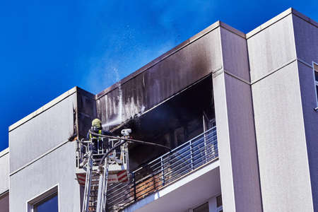 April 21, 2020, Riga Latvia: fire in a multitorey residential building on the top floorの写真素材