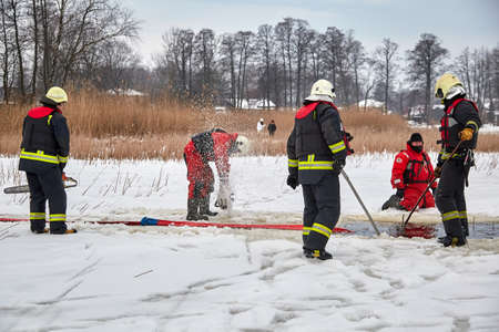 January 21, 2021, Baltezers, Latvia: The work of the rescue service to retrieve the car from the water. The car broke into the iceのeditorial素材
