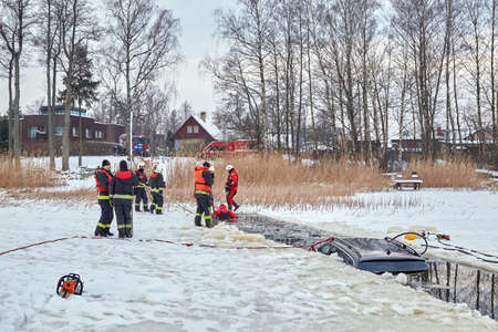 January 21, 2021, Baltezers, Latvia: The work of the rescue service to retrieve the car from the water. The car broke into the iceのeditorial素材