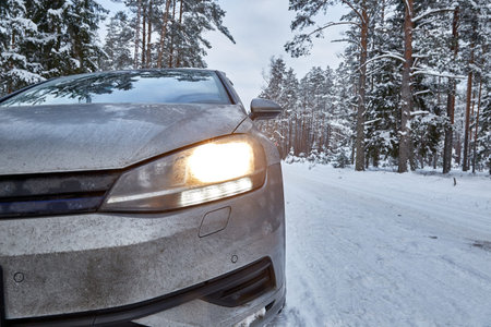 January 18, 2021, Engure Latvia: Car on snowy road in forest in winter