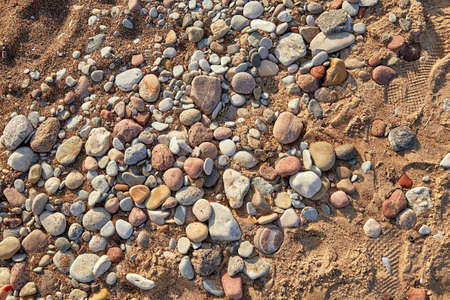 Stones at Baltic sea shore in Liepaja, Latvia in evening lightの写真素材