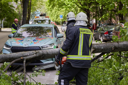 May 28, 2021,Riga Latvia: a strong wind broke a tree that fell on a car parked nearby, disaster...