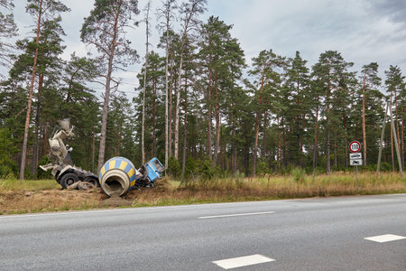 July 19, 2021 Vangazi, Latvia: concrete mixer truck that got into a car accident and went off the roadの写真素材