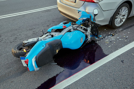 October 6, 2021, Riga, Latvia, damaged car and motorbike on the city road at the scene of an accident because of non-observance of distanceの写真素材