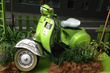 Lime green scooter found in downtown Kuala Lumpur. の素材