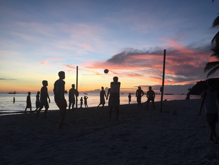 A game of beach volleyball is always funの素材