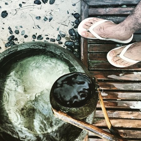 It's a tradition in the Philippines to wash one's feet before entering a house. This is to ensure that you did not bring in any sand into the house. Sandals and shoes are usually removed before entering the house.の素材