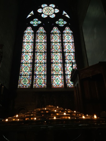 Beautiful stained glass windows are abound in cathedrals across Europe. Seen here the interior of the famous Notre Dame cathedral in Paris.の素材
