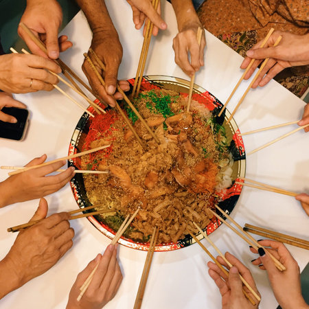 One of the Chinese tradition is to group all family members to usher in the new year by mixing up...