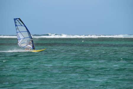 Windsurfer moving fast on the sea with waves in the の写真素材