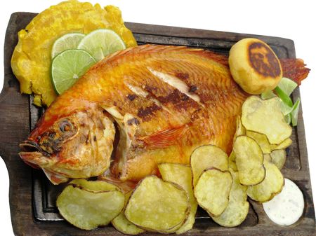 Fish and chips on a white plate with lemonの写真素材