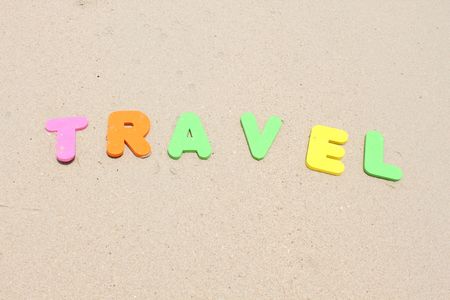 Travel text written with plastics letters colours. の写真素材