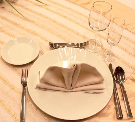Tables set for fine dining during a wedding event.の写真素材