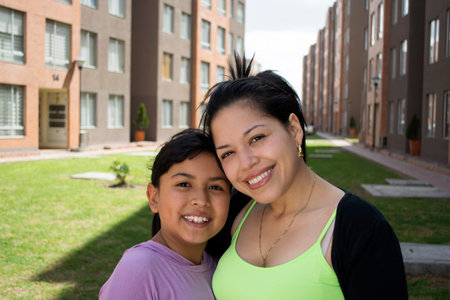 Happy mother and daughter laughing outdoor.の写真素材