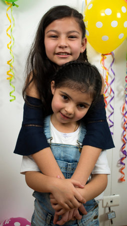 Smiling and huges children friends.