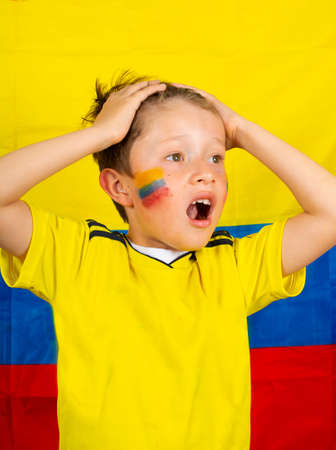 Boy football player after goal scoredの写真素材