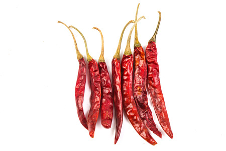 Peppers drying on a white backgroundの写真素材