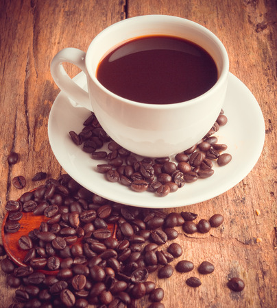 Cup of coffee on an old wooden tableの写真素材