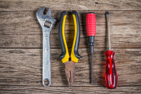 Set of tools on wood panelの写真素材