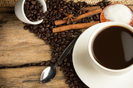 Cup of coffee on an old wooden tableの写真素材