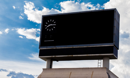 scoreboard at football stadium with skyの写真素材