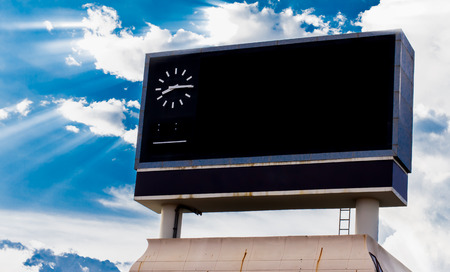 scoreboard at football stadium with sky with Clouds and Sun Rays.の写真素材