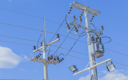 electricity post with clear blue skyの写真素材
