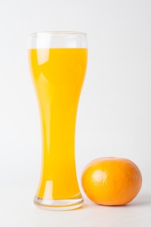 Orange juice and slices of orange isolated on whiteの写真素材