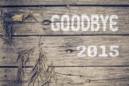 Goodbye 2015 on old wood backgroundの写真素材