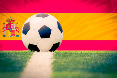 Spain soccer ball against Spain flag,vintage colorの写真素材
