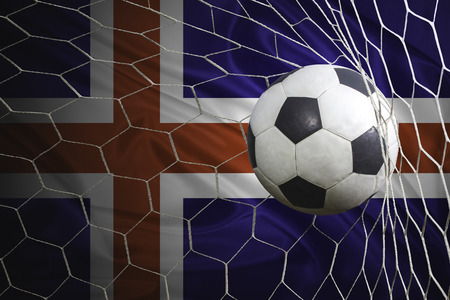 Iceland flag and soccer ball, football in goal netの写真素材