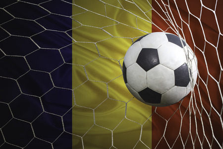 Romania flag and soccer ball, football in goal netの写真素材