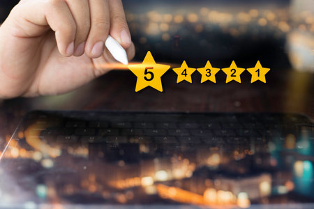 Reviews 5 stars rating with businessman using tablet. Customer service evaluation and satisfaction. Top service, ISO certification, Guarantee, Quality assurance, Standards.の写真素材