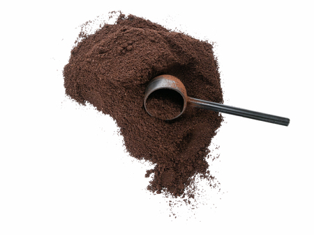 Isolated top view of ground coffee with scoopの写真素材