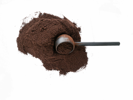 Isolated top view of coffee grounds with scoopの写真素材