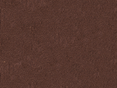 Surface comprised of coffe grounds for background or textureの写真素材