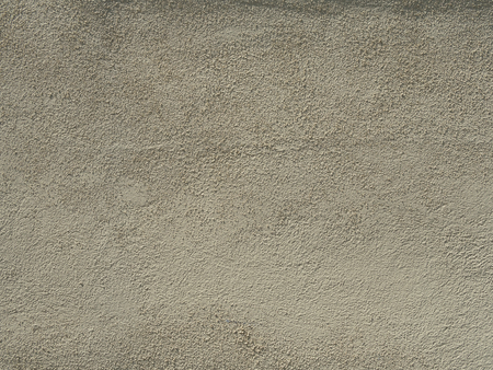 Beige stucco textured wall backgroundの写真素材