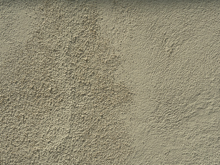 Beige stucco textured wall backgroundの写真素材