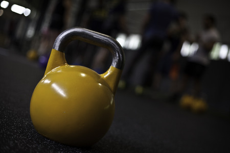 yellow crossfit kettlebell in a gymの写真素材