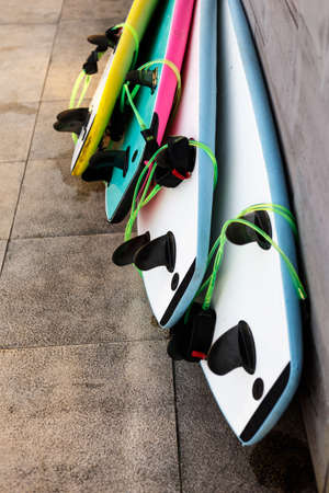 surfboards on the ground at sunsetの写真素材