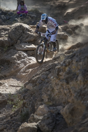 GRANADA, SPAIN - OCTOBER 25: Unknown racer on the competition of the mountain downhill bike "Cumbres Verdes, La Zubia" on October 25, 2012 in Granada, Spainのeditorial素材
