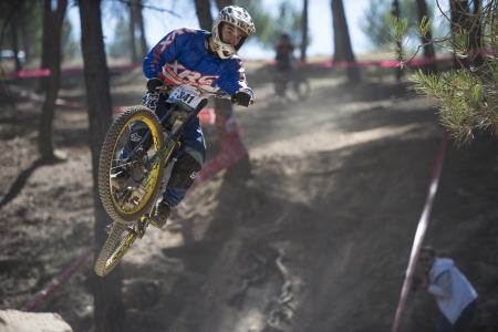 GRANADA, SPAIN - OCTOBER 25  Unknown racer on the competition of the mountain downhill bike  Cumbres Verdes, La Zubia  on October 25, 2012 in Granada, Spainのeditorial素材