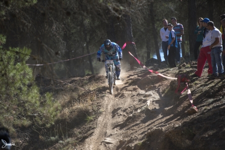 GRANADA, SPAIN - OCTOBER 25  Unknown racer on the competition of the mountain downhill bike  Cumbres Verdes, La Zubia  on October 25, 2012 in Granada, Spainのeditorial素材