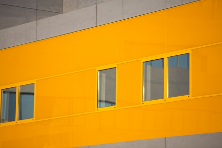 Modern office buildings. Colorful buildings in a industrial place. Orange windows.の写真素材